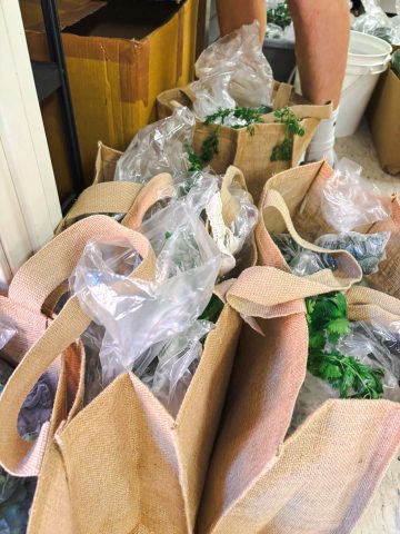 Burlap Bags with local food from the New Melle Food Co-op CSA